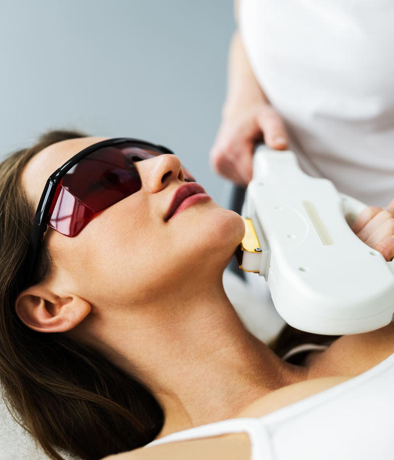 Woman with sunglasses getting an IPL Photofacial | La Jolla Cosmetic Laser Clinic In San Diego